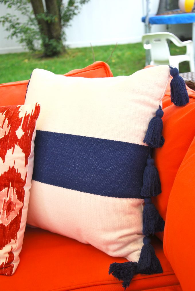 striped pillow with large tassel trim
