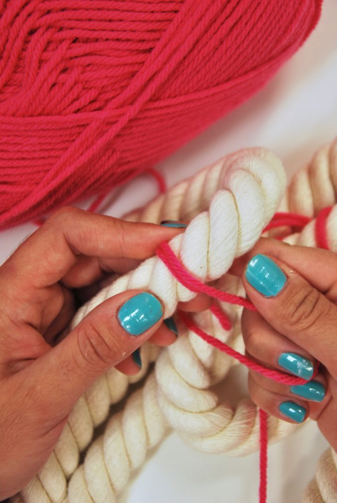 pink-yarn-wrapping-around-twist-rope-for-wall-hanging