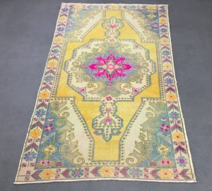 vintage yellow and pink oushak rug